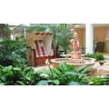 Unser zentraler Wintergarten mit Brunnen